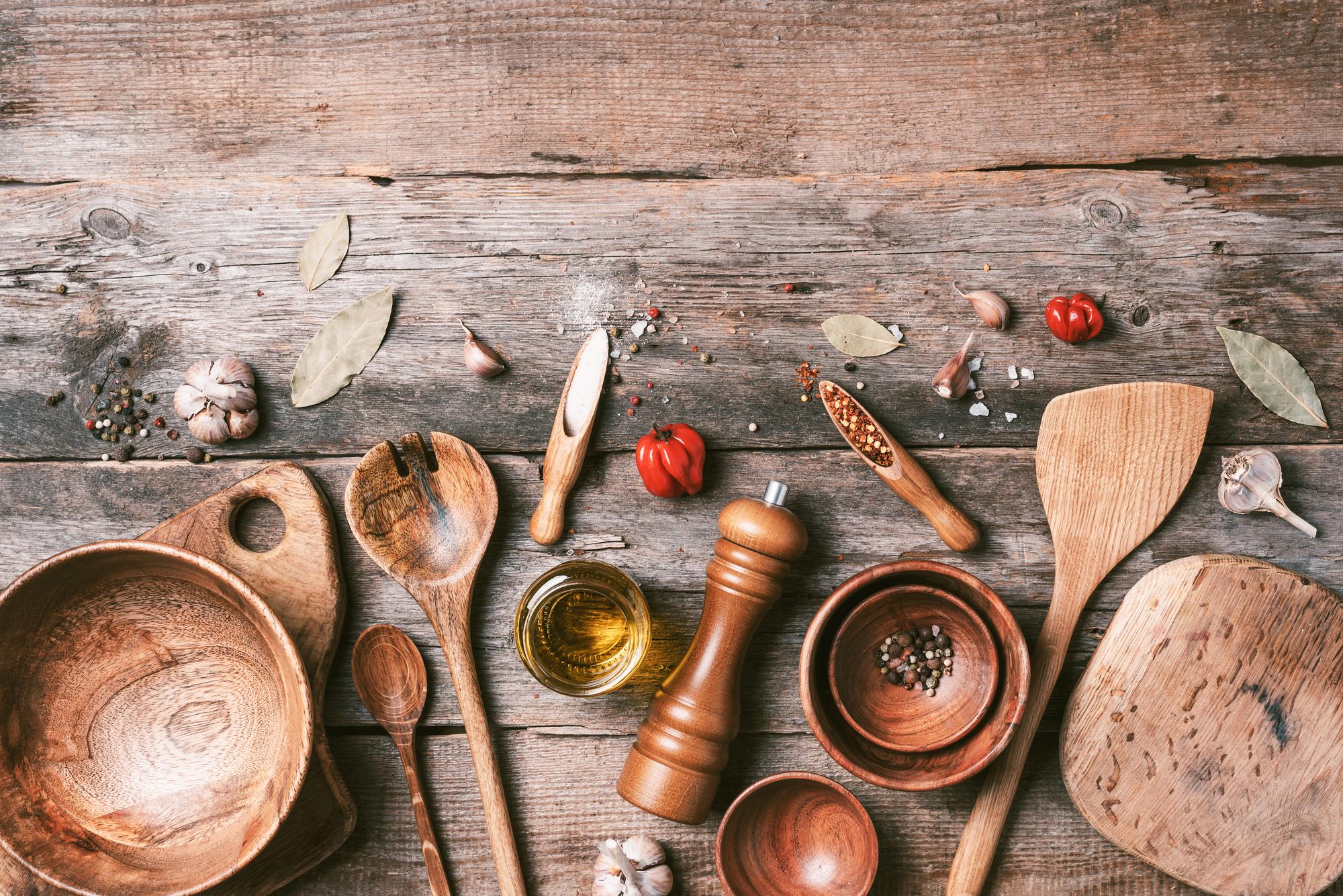 Small teaching kitchen with copper pans and herbs